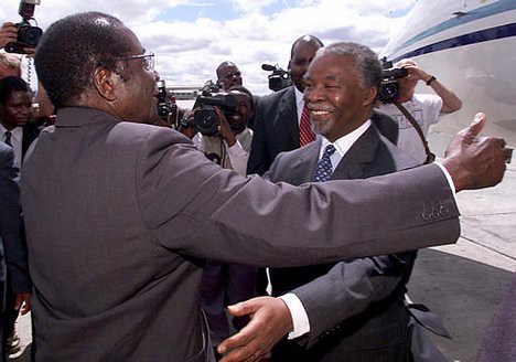 Zimbabwe President Robert Mugabe greeting former South African President Thabo Mbeki. The two leaders are working on a unity government plan for Zimbabwe. by Pan-African News Wire File Photos