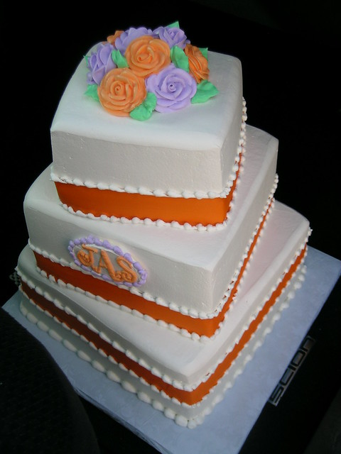 orange and purple wedding cake