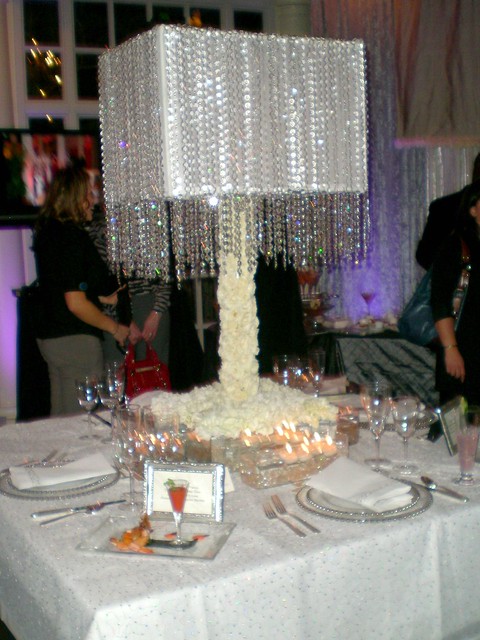 A lampshade for a wedding centerpiece Crystals drape down the sides of the 