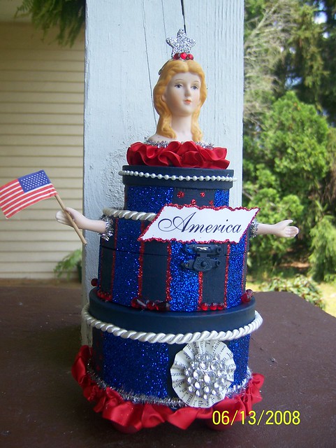 An AllAmerican wedding cake of sorts Three navy blue boxes are connected 