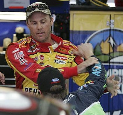 Drivers Kevin Harvick left and Carl Edwards right scuffle in the 