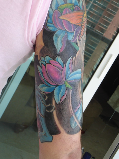 Tattoo Half Sleeve back view lotus flowers
