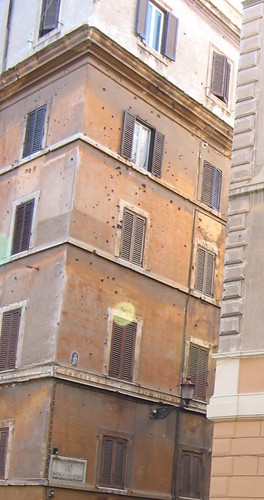 Bullet-holes on ochre stucco