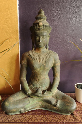 Medicine Buddha seated in the Dhyana Mudra, Thai style, green and gold patina ceramic, purple and yellow wall, Thai fabric, Uma Thai restaurant, Ballard, Seattle, Washington, USA by Wonderlane