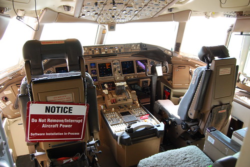 Boeing 777 cockpit, note software update in progress...