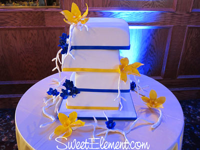 Offset Square Blue Yellow Wedding Cake With Cymbidium Orchids 