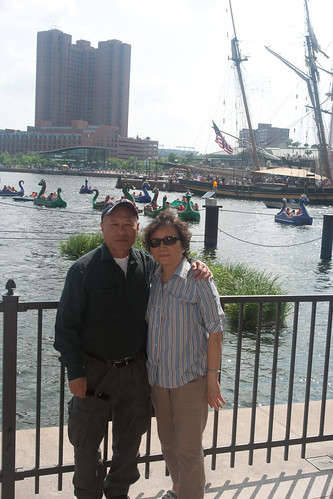 Duc and Mai in front of the Dragon Boats