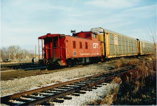 Southbound Grand Trunk Western Railroad freight train with a caboose rounding the interchange curve. Hayford Junction. Chicago Illinois. December 1988. by Eddie from Chicago
