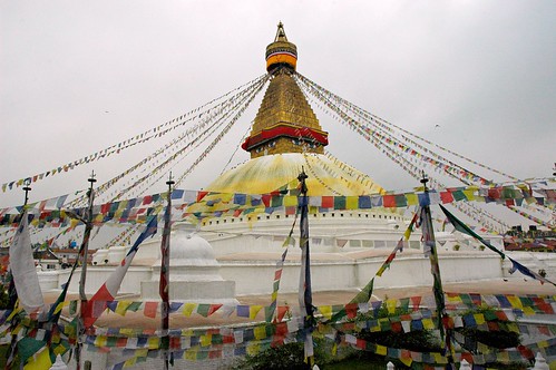 Boudha Stupa, eyes of the Buddha, fresh yellow lotus petal wash, new prayer flags, overcast day, Boudha, Kathmandu, Nepal by Wonderlane