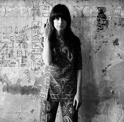 Hippie Girl Grace Slick of Jefferson Airplane gives the finger