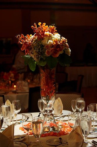 Tall wedding centerpiece with orange and white flowers
