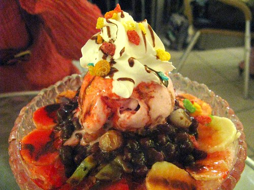 The Ice Kiss is: whipped cream, fruity pebbles, strawberry ice cream, bananas, jujube-type things, red beans, a little canned fruit of some kind, and the occasional strawberry -- all atop a bed of shaved ice with strawberry juice in it.