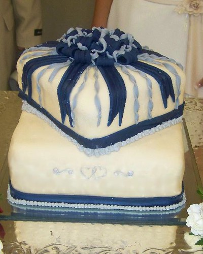 Ivory fondant with blue and silver fondant ribbon Silver royal icing hearts 