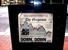 Oregonian newspaper: falling graph and headline 'DOWN, DOWN ...'