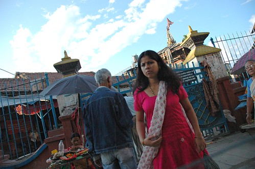 The scarf, shrine entrance, man in levi blue fabric, through a taxi window, Kathmandu, Nepal by Wonderlane