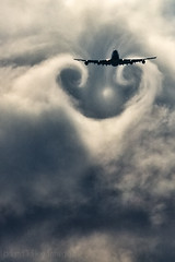 Commercial airplane and wake turbulence. by Greg Bajor