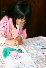 Olivia Painting with Watercolors on Canvas