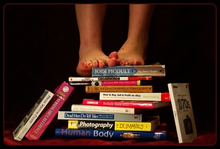 feet standing on books