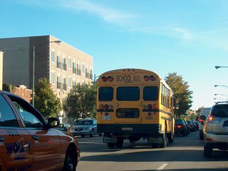 Southbound school bus on North western Avenue during the late afternoon rush hour. Chicago Illinois. October 2007. by Eddie from Chicago