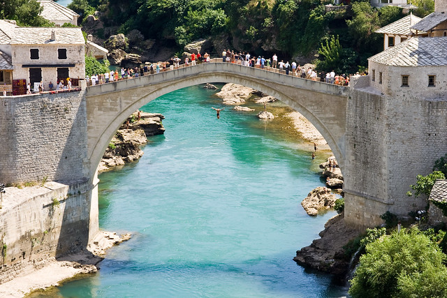 Jumping off the Mostar Bridge in Bosnia. Photo by lassi.kurkijarvi on Flickr.