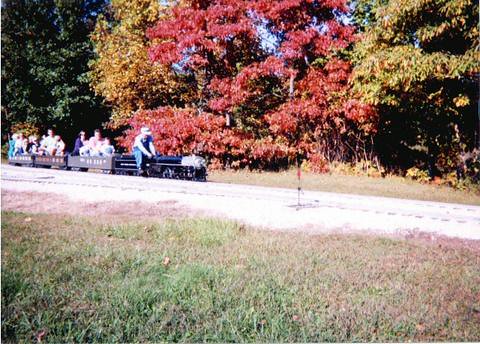 Miniature live steam New York Central RR J-1E class 4-6-4 Hudson and train passing through Autum colors. The Hesston Steam Museum. Hesston Indiana USA. October 1998. by Eddie from Chicago