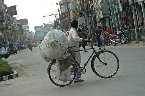 One man's personal effort against poverty, recycler on a bicycle, Kathmandu, Nepal by Wonderlane