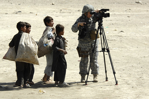 U.S. Air Force Technical Sergeant Susan K. Williams, International Security Assistance Force (ISAF) Combat Correspondent, prepares her video equipment.