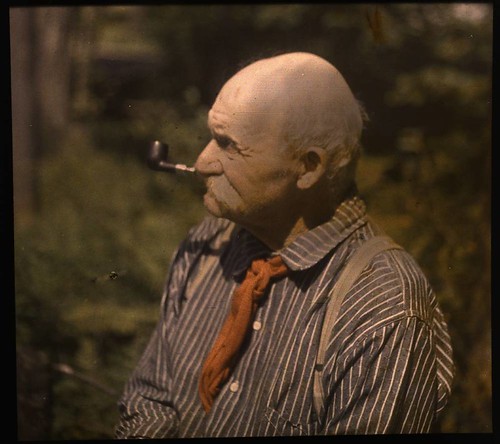 Mustached man smoking pipe