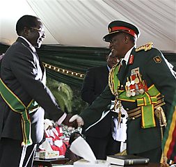 The Commander of  the Defence Forces, Constatine Chiwenga, congratulates President Robert Mugabe, during the inauguration ceremony at State House in Harare, Zimbabwe, Sunday, June, 29, 2008. by Pan-African News Wire File Photos