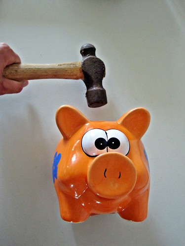 Piggy Bank being Smashed with Hammer