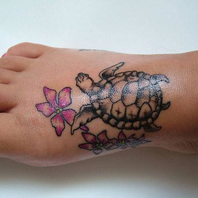 foot tattoo flowers n turtle