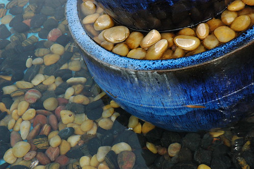 Fountain of blue pot river rock by Wonderlane