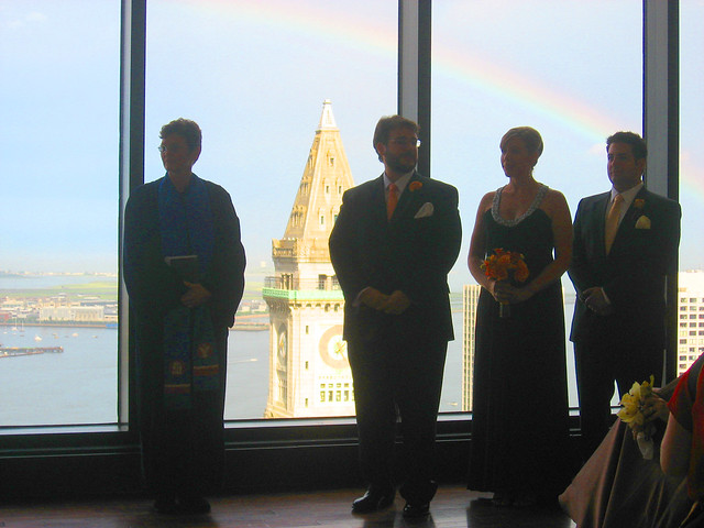 Rainbow over wedding party