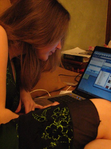 Teen girl talking to online predator on laptop
