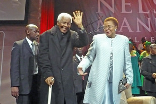 Former South African President Nelson Mandela with his wife Graca Machel at a 90th birthday gathering in South Africa. by Pan-African News Wire File Photos