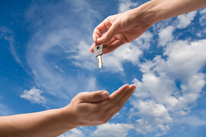 Handing over keys on blue sky