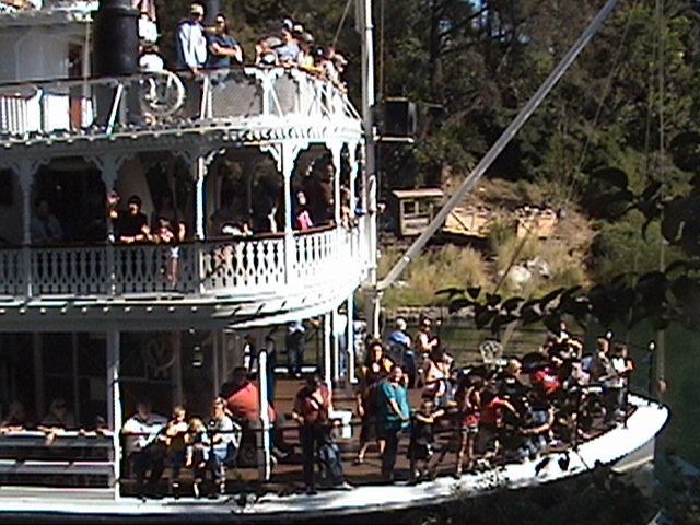 Mine Train thru Nature's Wonderland wreck display on the Rivers of America as the S.S. Mark Twain sternwheel packet steamer passes by, 2008.10.24