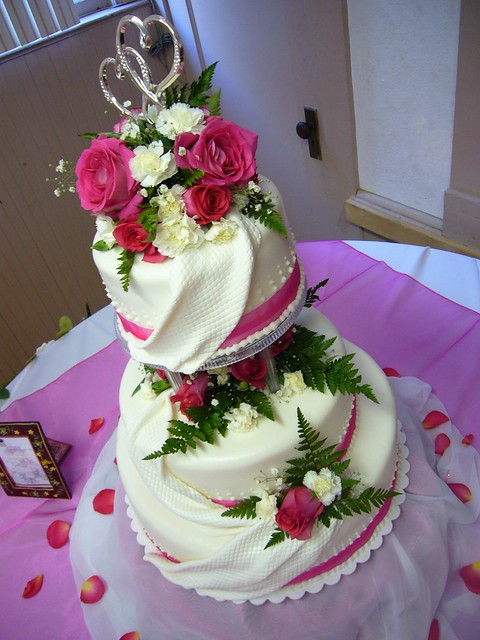 Pretty and Pink Wedding Cake All draped in rolled buttercream 