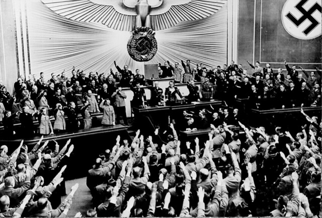 Hitler accepts the ovation of the Reichstag after the Anschluss of Austria in March 1938