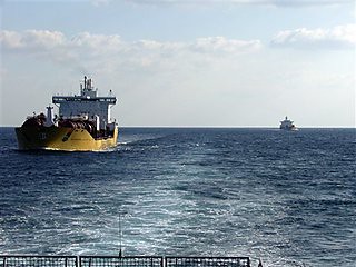 Dutch cargo ships the MV Stolt Innovation, in the foreground, and the MV Stolt Helluland, in the background, seen from the rear of Dutch warship de Ruyter in the Gulf of Aden on Tuesday, Dec. 9, 2008. by Pan-African News Wire File Photos