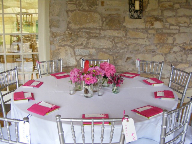 This gorgeous table was designed using a white tablecloth and fuschia 