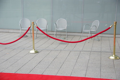 Red carpet? Velvet Rope? Keeps the chairs away...