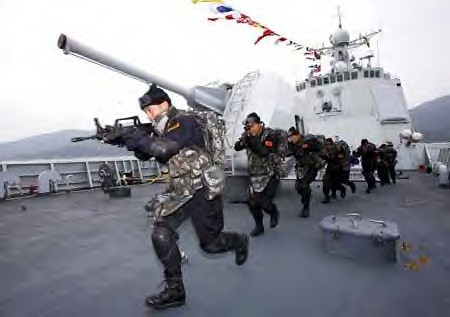 Soldiers of Chinese navy special force carry out an anti pirate drill on the deck of DDG-171 Haikou destroyer in Sanya, capital of South China's Hainan Province, on Dec. 25, 2008.(Xinhua Photo) by Pan-African News Wire File Photos
