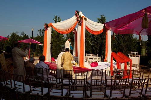 Orange and red Indian wedding mandap Image by Regeti's Photography