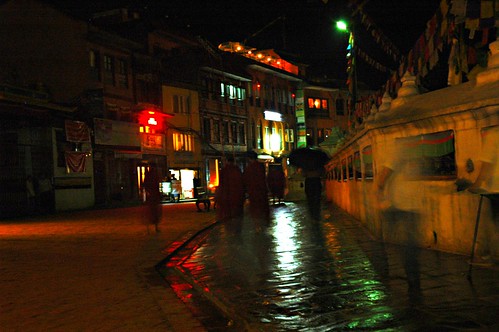 Wet street Boudha Stupa Kathmandu Nepal by Wonderlane