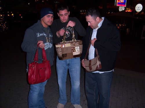 boyfriends holding purses