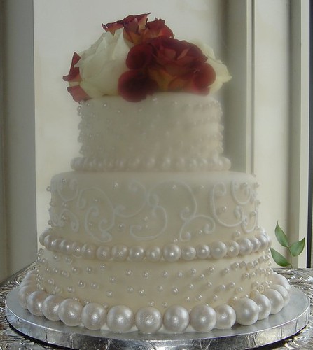 Custom fondant wedding cake with handrolled pearls and roses 016