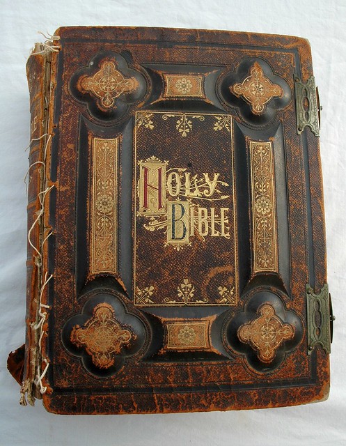 Holy Bible, dated 1885, antique gold lettering, leather and board, held together with dental floss