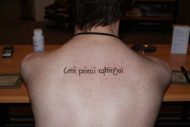 Eyeliner tattooing Elvish on Scott's back What a nerd