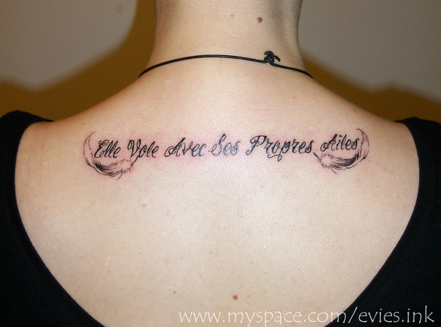 french writing tattoo with